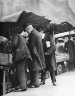 Bookstalls of the Farringdon Road market, London, 1926-1927.Artist: Walter Benington
