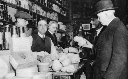 A customer inspects a haggis, London, 1926-1927. Artist: Unknown