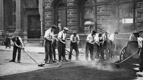 Workmen laying tar and asphalt in Cornhill, London, 1926-1927. Artist: McLeish