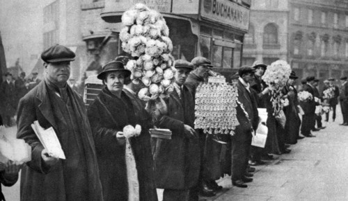 Street hawkers selling football favours in Walham Green, London, 1926-1927. Artist: Unknown