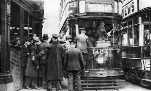 Getting on to a tram at Blackfriars, London, 1926-1927. Artist: Unknown