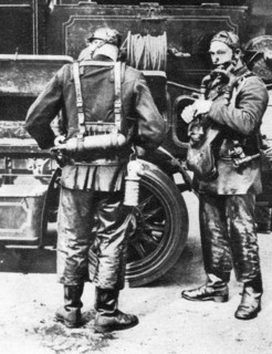Firefighters donning smoke helmets, Farringdon Street rubber works, London, 1926-1927. Artist: Unknown