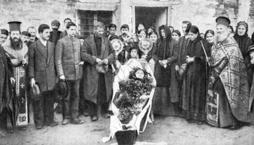 A dead Greek peasant lying in a coffin, 1922.Artist: HA Fawcett