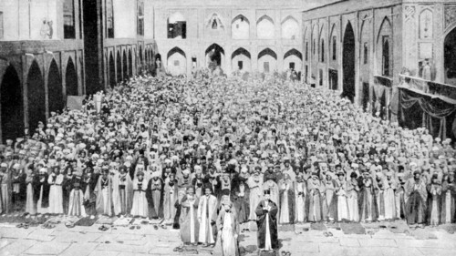 A congregation faces the holy Kaaba in Mecca's mosque, Saudi Arabia, 1922. Artist: Unknown