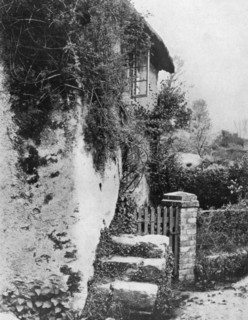 A cottage with an ancient 'upping stock', Cockington, Devon, 1924-1926.Artist: HJ Smith