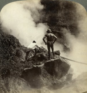 Watching an eruption of steam and boiling mud halfway up the volcano of Aso-san, Japan, 1904. Artist: Underwood & Underwood