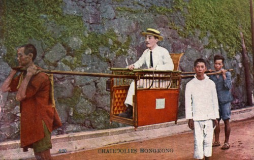 Man being carried on a Sedan chair, Hong kong, 20th century. Artist: Unknown