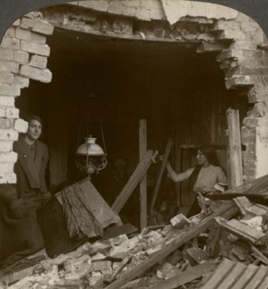 The damage done by a German Zeppelin bomb, World War I, 1914-1918.Artist: Realistic Travels Publishers