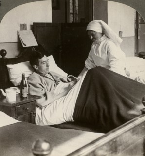 A soldier writing a letter in hospital, World War I, 1914-1918.Artist: Realistic Travels Publishers