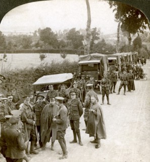 Ammunition convoy parked in a Flanders lane awaiting orders, World War I, 1914-1918.Artist: Realistic Travels Publishers