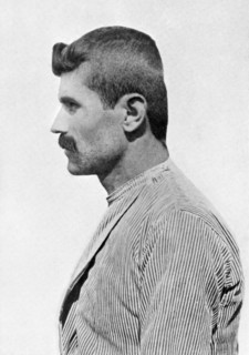 A man with a flattened head. Artist: Unknown