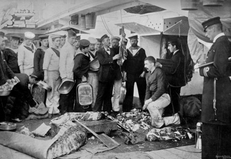 Serving out a day's fresh meat ration on board HMS 'Talbot', 1896. Artist: WM Crockett
