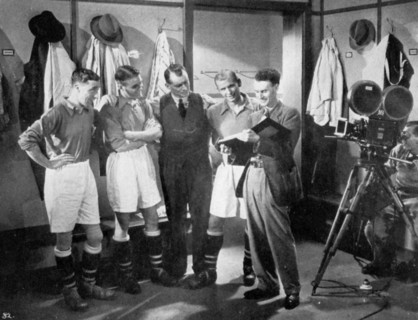 A pause for instruction from film producer Anthony Asquith, Twickenham, London, c1932. Artist: Unknown