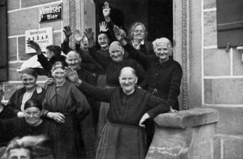 Inhabitants of a small town during a visit by Adolf Hitler, Franconia, Germany, 1936. Artist: Unknown