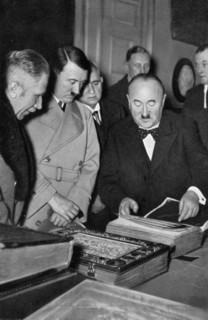 Adolf Hitler being shown the treasures of the Bavarian State Library, Germany, 1936. Artist: Unknown