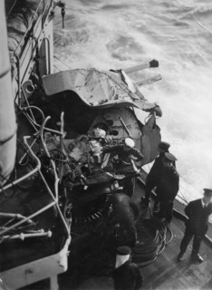 Damaged anti-aircraft gun on the British battleship HMS 'Malaya', off the coast of Portugal, 1937. Artist: Unknown