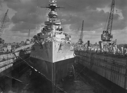 British battleship HMS 'Malaya' in a floating dock, Malta, c1937. Artist: Unknown