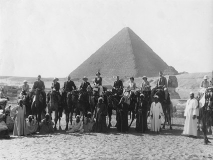 Camel tour in front of one of the Pyramids of Giza, Egypt, c1920s-c1930s(?). Artist: Unknown
