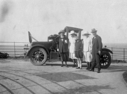 A group of people in front of their car at the seaside, c1920s(?). Artist: Unknown