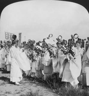 Shinto priests in a funeral procession for 'Hitachi Maru' victims, Tokyo, Japan, 1905. Artist: HC White
