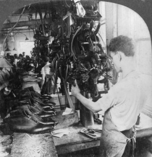 Lasting machine shaping shoes in shoe factory, Lynn, Massachusetts, USA, early 20th century(?). Artist: Keystone View Company