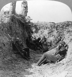 Troops waiting in a trench near Arras, France, World War I, c1914-c1918.  Artist: Realistic Travels Publishers