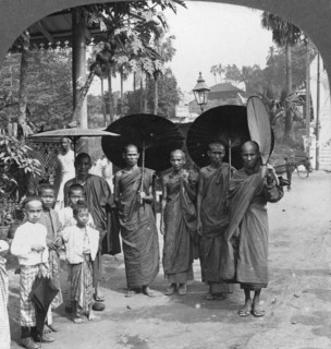 Buddhist monks with sunshades and fans, Rangoon, Burma, 1908. Artist: Stereo Travel Co