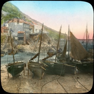 Fishing fleet at low tide, Polperro, Cornwall, late 19th or early 20th century. Artist: Church Army Lantern Department