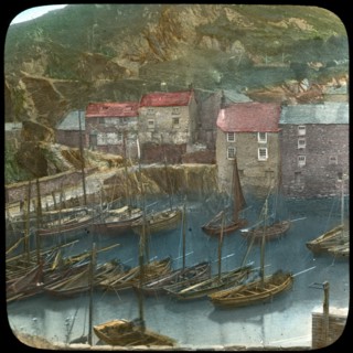 Fishing boats in the harbour, Polperro, Cornwall, late 19th or early 20th century. Artist: Church Army Lantern Department