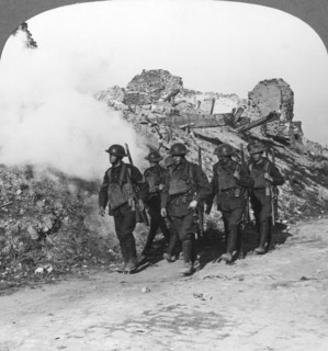 Troops passing the ruins of Monchy on the way up the line, France, World War I, c1914-c1918. Artist: Realistic Travels Publishers