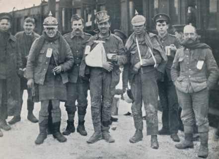 Some cheerful wounded from the Neuve Chapelle fighting, wearing captured German helmets, 1915. Artist: Unknown