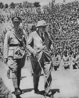 'Home via the Battlefields - Mr Churchill in the ancient Roman amphitheatre at Carthage', 1943-44. Artist: Unknown.