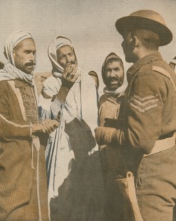 'Tunisian Arabs Welcome a British Sergeant at Chaouach', 1943. Artist: Unknown.