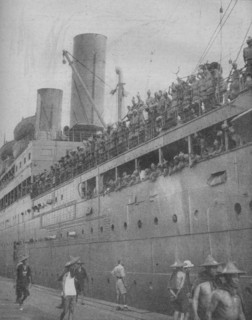 'At Singapore Indian troops arrive to take part in the defence of the great fortress-port.', 1941.  Artist: Unknown.