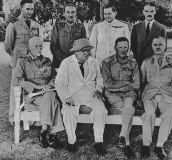'At the Front in Egypt: Mr. Churchill in Cairo with members of the Middle East War Council', 1942. Artist: Unknown.
