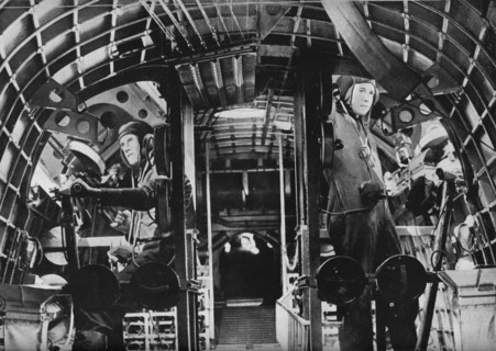The midship gunners of an RAF flying boat alert at their stations, c1940 (1943). Artist: Unknown.