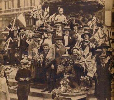Victory celebrations underneath Eros, Piccadilly, London, 1918, (1938). Artist: Unknown.