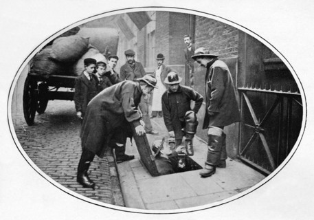 Sewermen going below, London, c1903 (1903). Artist: Unknown.