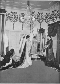 The finishing touches of a dressmaker, London, c1901 (1901). Artist: Unknown.