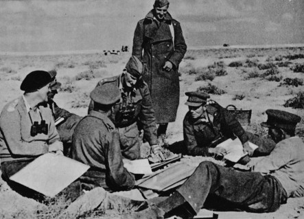 'Maps and plans are spread on the sand', 1942 (1944). Artist: Unknown.