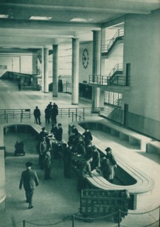 Customs officers examining passengers' baggage at Le Bourget Airport, Paris, 1937. Artist: Unknown.