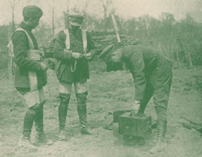 Aerial photographers fixing on parachute harnesses before making an ascent, c1917 (1919). Artist: Unknown.