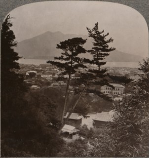 'Vista from hills above Kagoshima over Lake to distant Sakurajima volcano, Japan', 1904. Artist: Unknown.