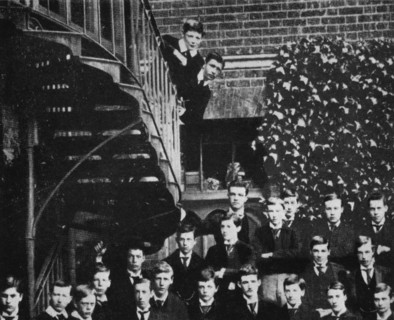 'Winston climbing a staircase, while the class pose', c1889, (1945). Artist: Unknown.