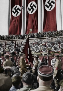 Adolf Hitler dedicates new standards, Nuremberg Rally, Germany, 1934.  Artist: Unknown.