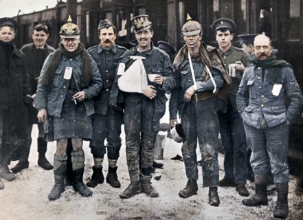 Some cheerful wounded from the Neuve Chapelle fighting, wearing captured German helmets, 1915. Artist: Unknown.