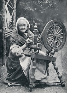 An old Irish woman at her spinning-wheel, 1912. Artist: W Lawrence.