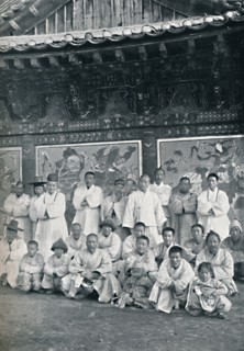 Priests and monks in a Korean monastery, or lamasery, 1902. Artist: Walter Hillier.