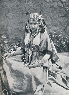 An Algerian woman in gala costume, 1912. Artist: Neurdein freres.