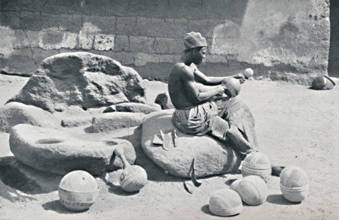 A Yoruba man engraving clay bowls and water jars, Lagos hinterland, Southern Nigeria, 1912. Artist: AW Gelston.